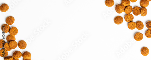 Dutch holiday Sinterklaas banner background with copy space for text. Kruidnoten cookies. Concept for children party Saint Nicolas day five december in the Netherlands. Top view, overhead.