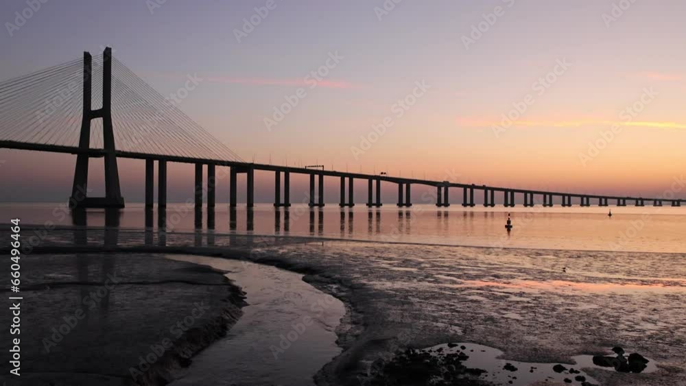 landscape at sunrise next to the Vasco da Gama bridge in Lisbon, Portugal landscape at sunrise next to the Vasco da Gama bridge in Lisbon, Portugal