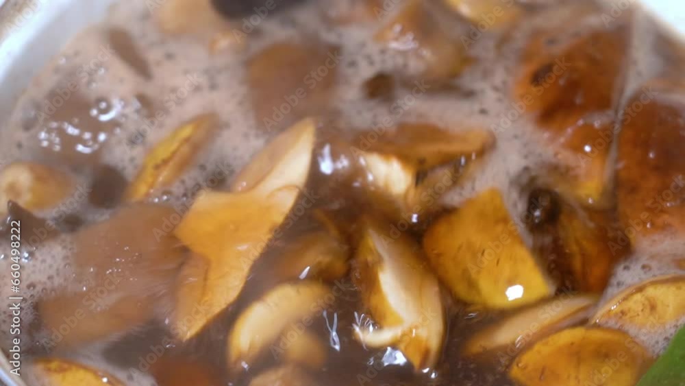 Forest mushrooms boiled in a saucepan