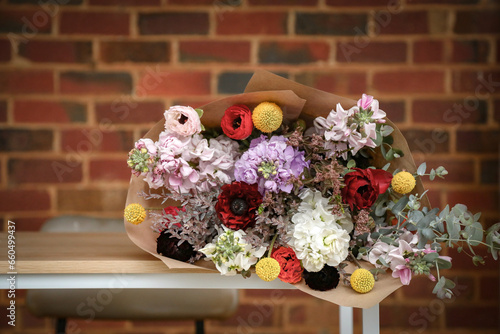 Bunch of cut cottage flowers in rustic country setting