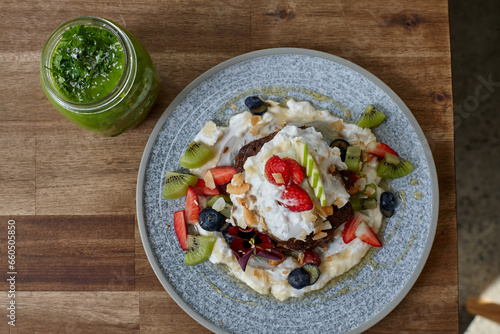 Healthy organic vegan food and drinks on wooden table photo