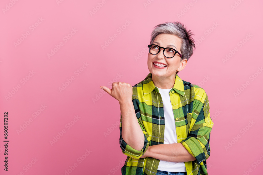 Portrait of nice person with white gray hair dressed plaid shirt look directing at offer empty space isolated on pink color background Portrait of nice person with white gray hair dressed plaid shirt look directing at offer empty space isolated on pink color background