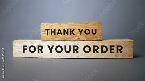 Thank you for your order words carved on the wooden surface. Thank you Compliment. photo