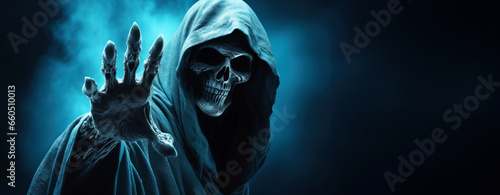 Scary grim reaper death halloween skeleton ghost character with copy space photo