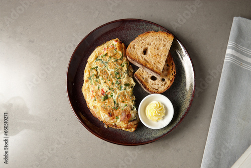 Egg omelette and toast on plate photo