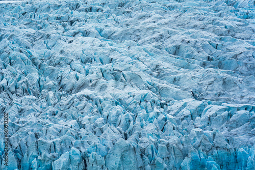 Rugged textured natural blue iceberg in Fjallsarlon iceberg lagoon © Mumemories