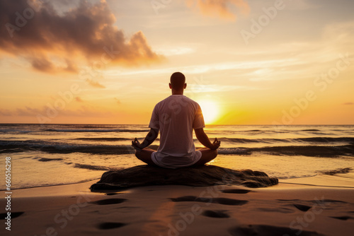 Man mediating on the beach - Mindfulness in Nature