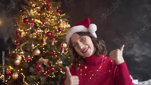 woman calls her friends via video conference call wishing Merry Christmas