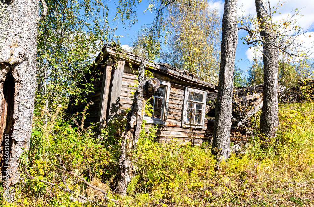 Rural abandoned broken wooden house in russian village