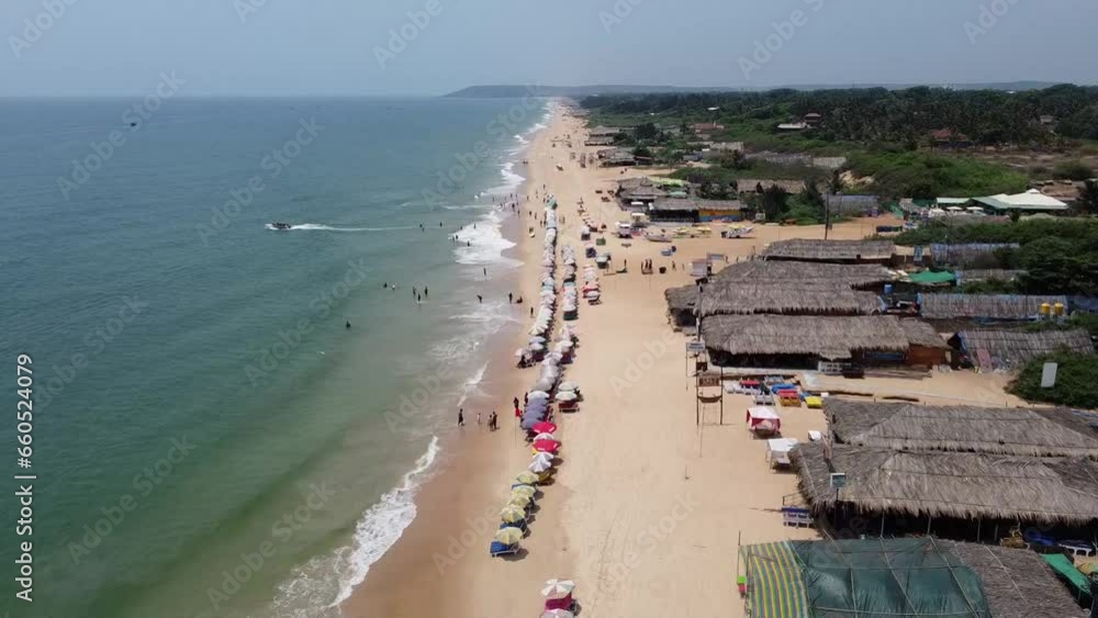 Drone view of Sea and the Beach in India, beautiful beach and shacks on Goa beach Drone view of Sea and the Beach in India, beautiful beach and shacks on Goa beach
