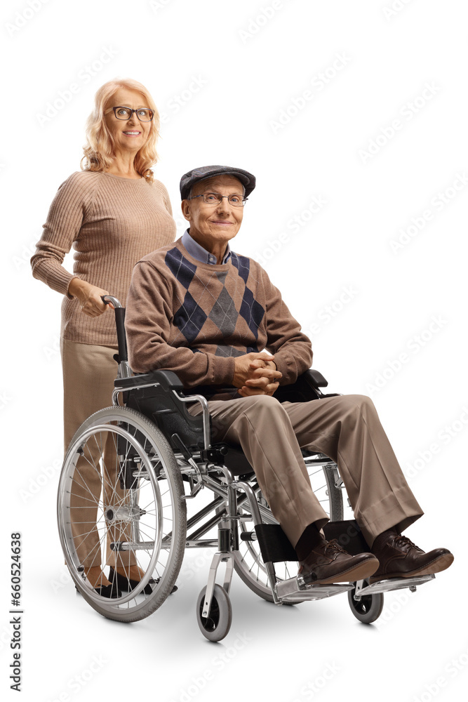 Woman standing behind an elderly man in a wheelchair Woman standing behind an elderly man in a wheelchair