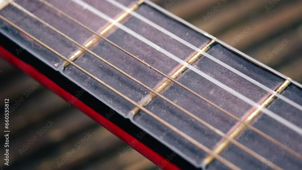 Classical guitar strings and frets close up macro Classical guitar strings and frets close up macro
