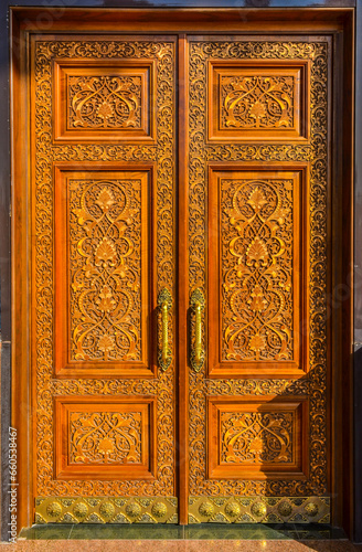 carved wooden door with ornaments in traditional Uzbek style (National Park of Uzbekistan named after Alisher Navoi in Tashkent)
