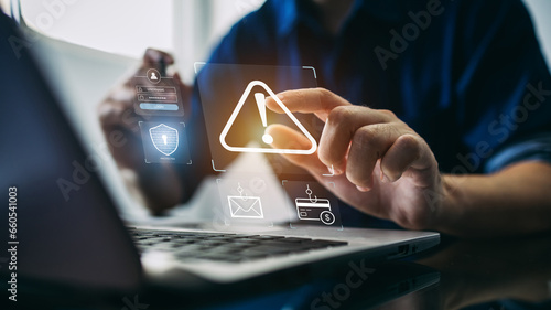 Fototapeta Naklejka Na Ścianę i Meble -  Concept of cyber crime and cyber security. Hand using laptop and show malware screen with phishing email, hack password and personal data. hackers, Virus Trojans, Encription Spyware or Malware.