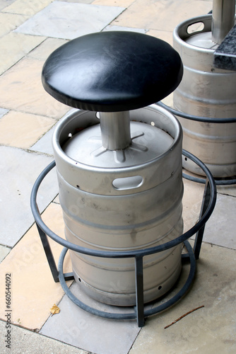 Metal bar stool made from beer keg overhead angle