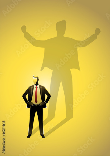Businessman standing and casting a shadow of a strong superhero