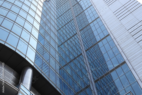 A mirror reflection of a modern skyscraper