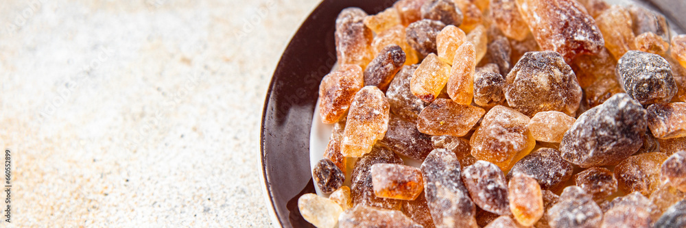 cane sugar crystal rock pieces candy brown sugar candied big rock caramel crystalssugar taste eating cooking appetizer meal food snack on the table copy space food background rustic top view cane sugar crystal rock pieces candy brown sugar candied big rock caramel crystalssugar taste eating cooking appetizer meal food snack on the table copy space food background rustic top view