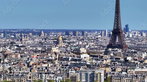 Aerial ascending footage of city center with popular tourist landmarks. Eiffel Tower, Hotel des Invalides, Pantheon and other sights. Paris, France photo