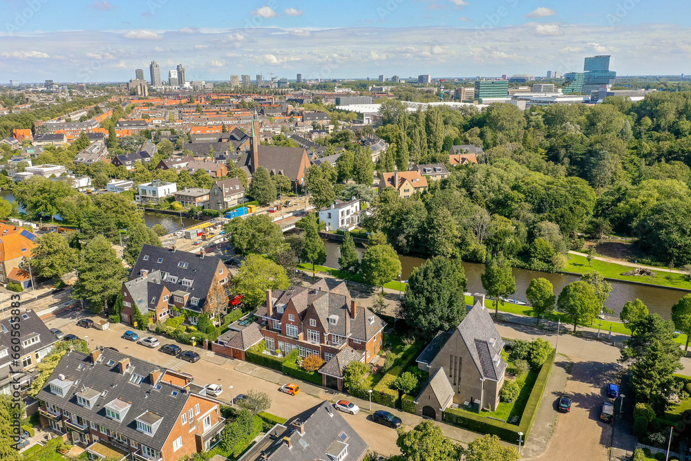 an aerial view of some houses in the netherlands, taken from a drone - free flight over amsterdam's canals