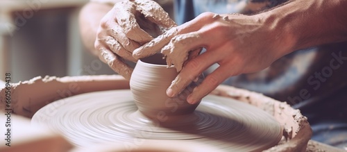Photographie make ceramic pots from clay in pottery workshop. works of art art