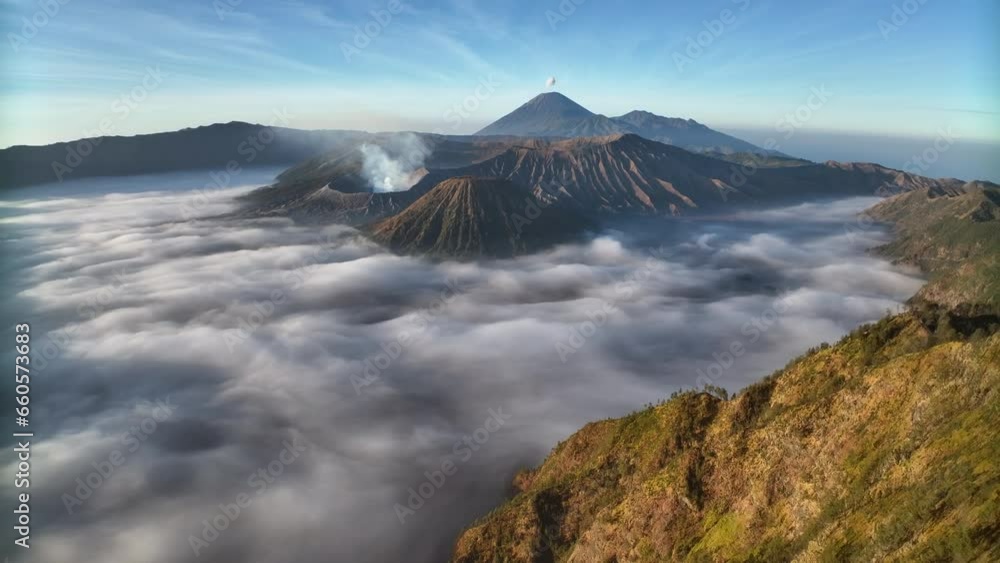 Aerial view fly back over the sea of mist to reveal Bromo volcano, Indonesia
Aerial view fly back over the sea of mist to reveal Bromo volcano, Indonesia
