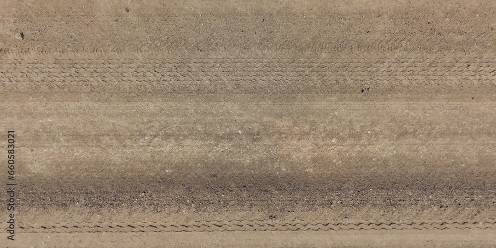 panorama of road from above on surface of gravel road with car tire tracks. panorama of road from above on surface of gravel road with car tire tracks.