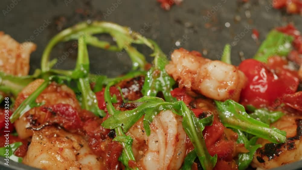 Pan with grilled prawn shrimps with garlic rosemary tomatoes and spices, chef cooking asian traditional thai food, wok restaurant. Studio shot close up, macro. Pan with grilled prawn shrimps with garlic rosemary tomatoes and spices, chef cooking asian traditional thai food, wok restaurant. Studio shot close up, macro.