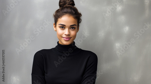 Portrait of a young woman in black sweater, embodiment of confidence photo