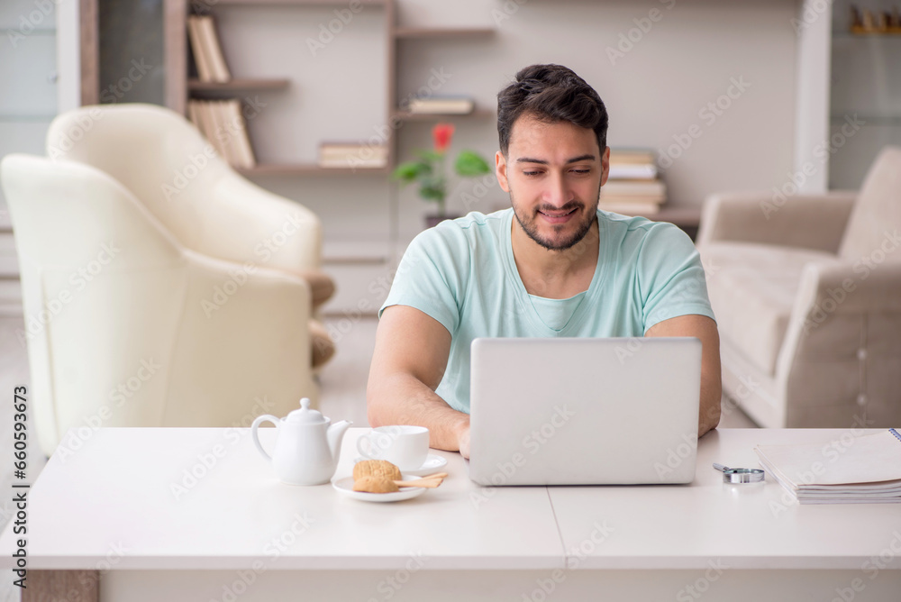 Young male freelancer working from home Young male freelancer working from home