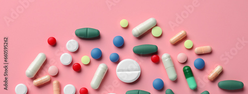 Medicines, tablets and pills on colored background.