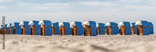 Tranquil Beach Getaway: Blue Beach Chairs by the Seashore
