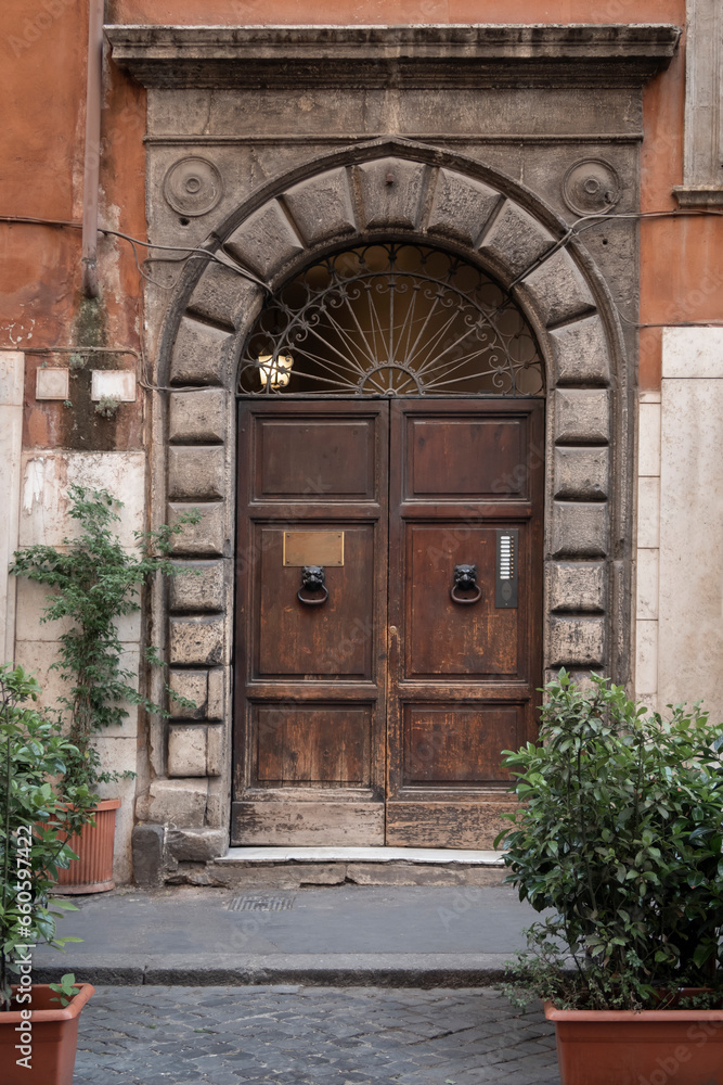 Fototapeta premium Ancient building with a wooden door
