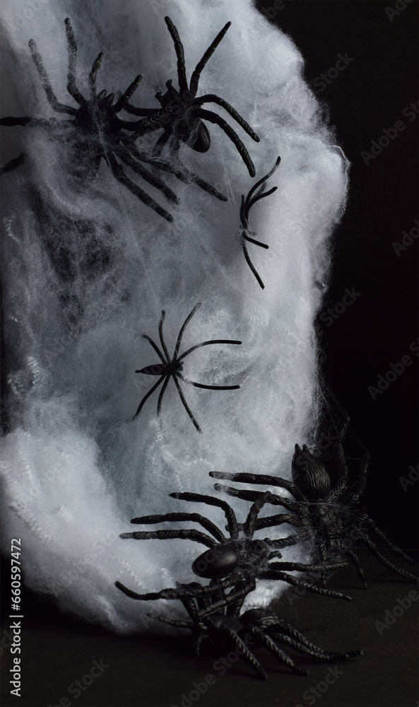 Terrifying and dark background with spiders. Vertical shot.