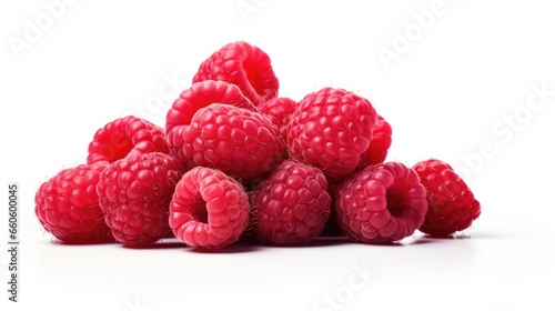A pile of raspberries on a white surface