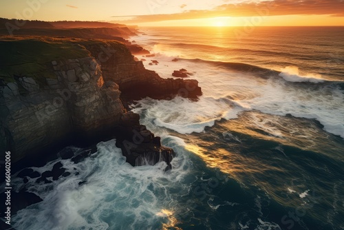 Drone Photo Displaying Crashing Ocean Waves Against Rocky Cliffs At Sunset, Creating Captivating Coastal Scene