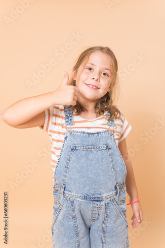 girl smiling from the front with raised thumb