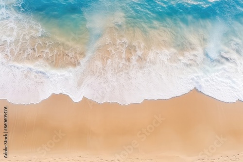 An Aerial View Of A Sandy Beach With Waves