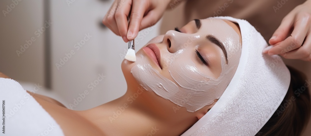 young woman having facial mask spa therapy in beauty salon - obrazy, fototapety, plakaty 