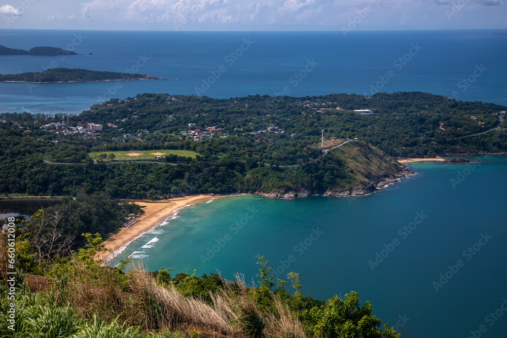 Beautiful beach with colorful water. Top view of the beautiful coastline. Sunny summer day. Colorful water. Sandy beach.	