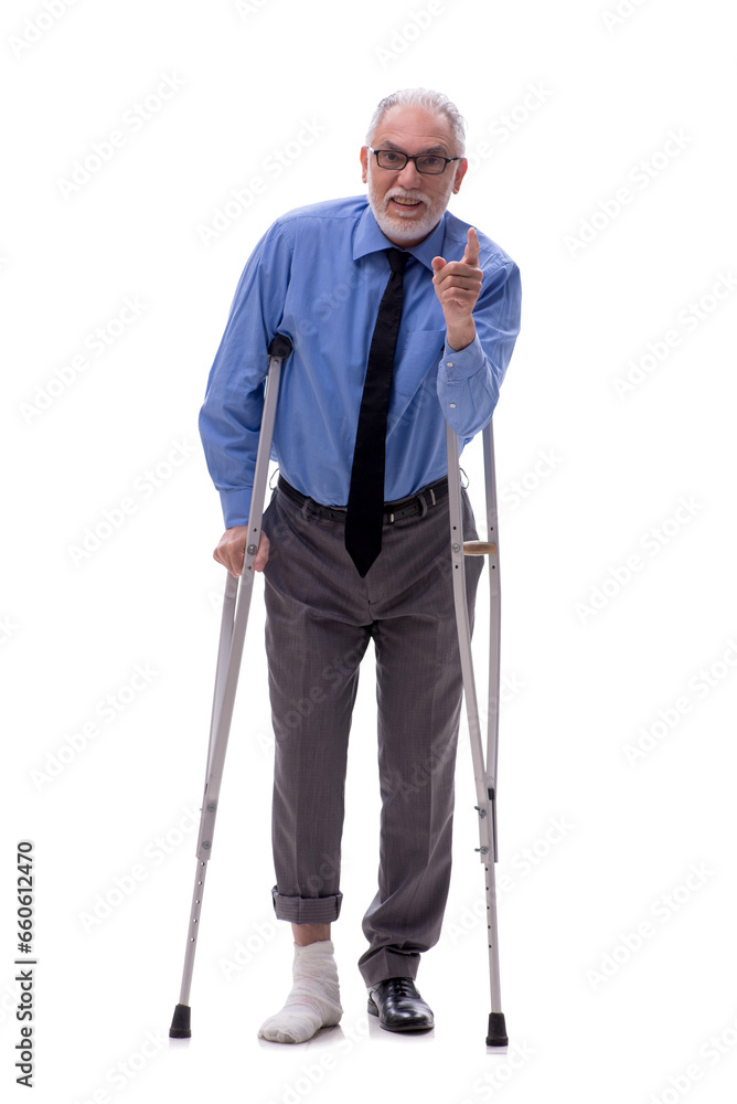 Old businessman with crutches isolated on white Old businessman with crutches isolated on white