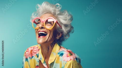Happy Elderly Grandmother Smiling in Glasses Against Vibrant Blue Background - Joyful Senior Woman Portrait