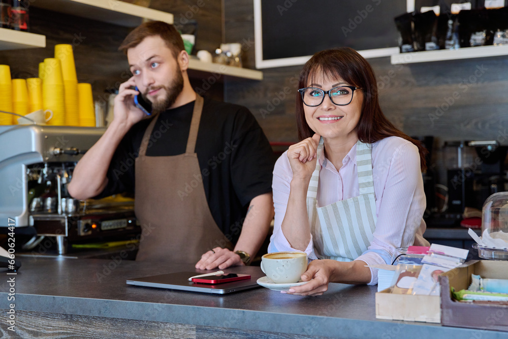 Team male and woman talking, working, using phone, coffee shop Team male and woman talking, working, using phone, coffee shop