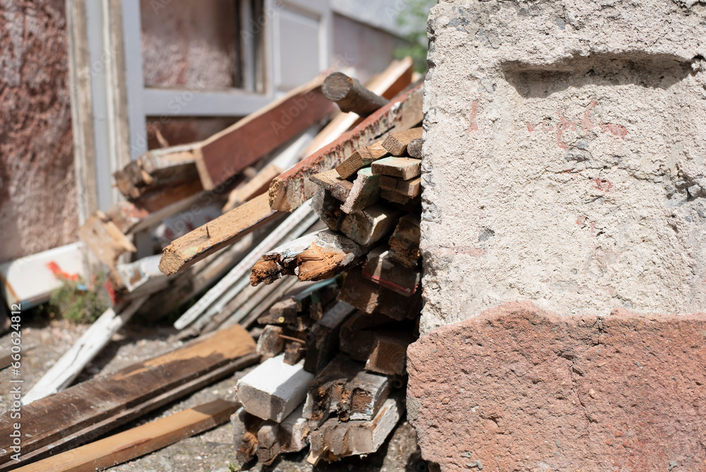 Old disassembled windows, wooden frames separately and glass separately, old wooden windows ready for disposal, replacement of windows with plastic ones Old disassembled windows, wooden frames separately and glass separately, old wooden windows ready for disposal, replacement of windows with plastic ones