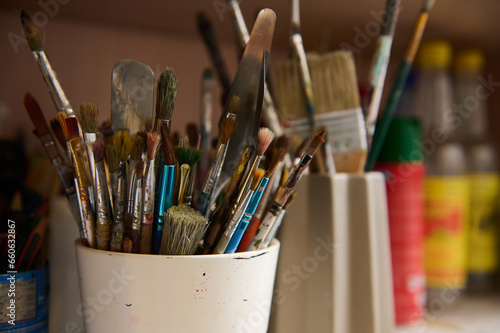 Horizontal photography of oil paintbrushes in creative art studio or workshop. Painting. Art class. Education.