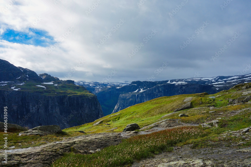 view of a fjord at the top of a cliff on the trolltunga hike