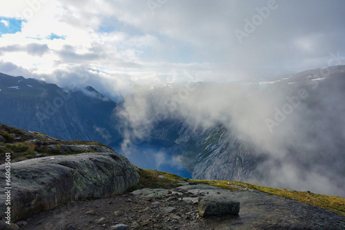 plunging view of the fjord at the foot of the trolltunga