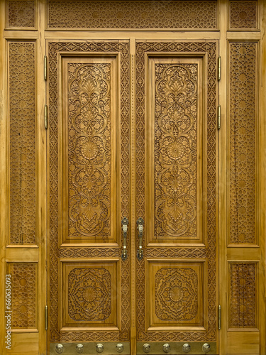 Wooden carved door with detailed decorative geometric designs