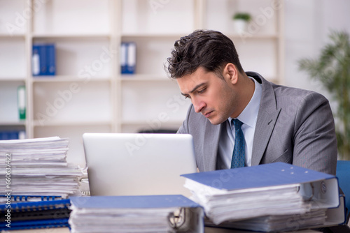 Young male employee working in the office