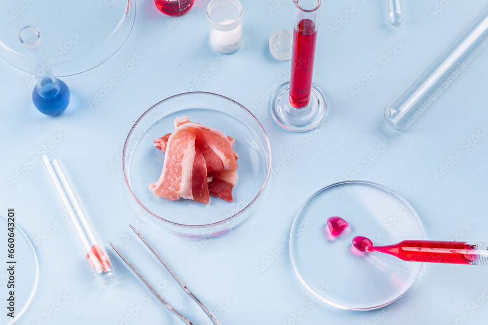 Cultured meat. Bacon in Glass Petri Dish. Laboratory Studies of Artificial Meat. Chemical Stock Image Cultured meat. Bacon in Glass Petri Dish. Laboratory Studies of Artificial Meat. Chemical Stock Image